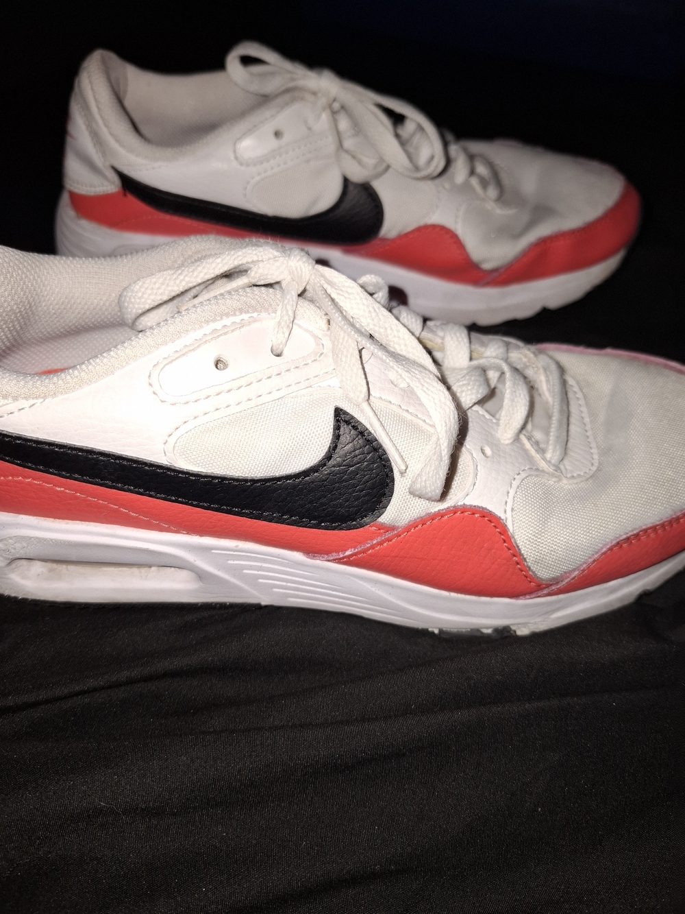 Nike Air Max SC in the "White/Magic Ember/Black" colorway.